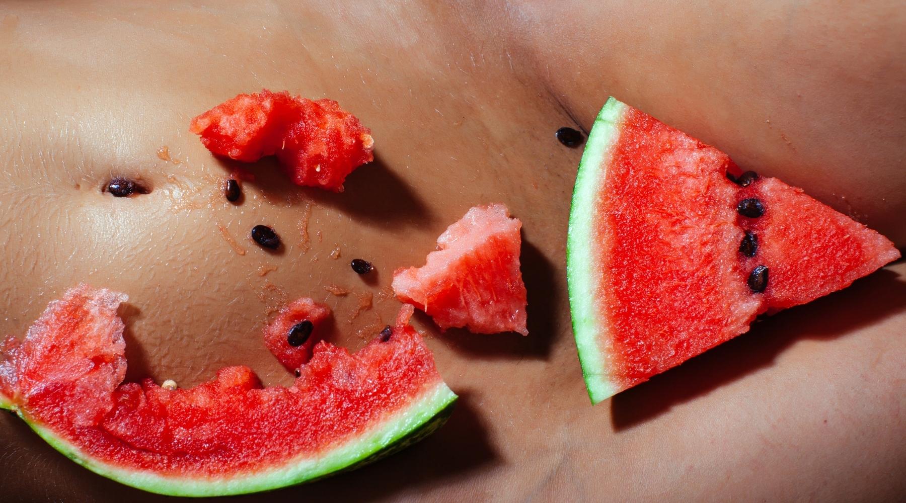 Slices of watermelon on a woman's skin for OneNightOnly