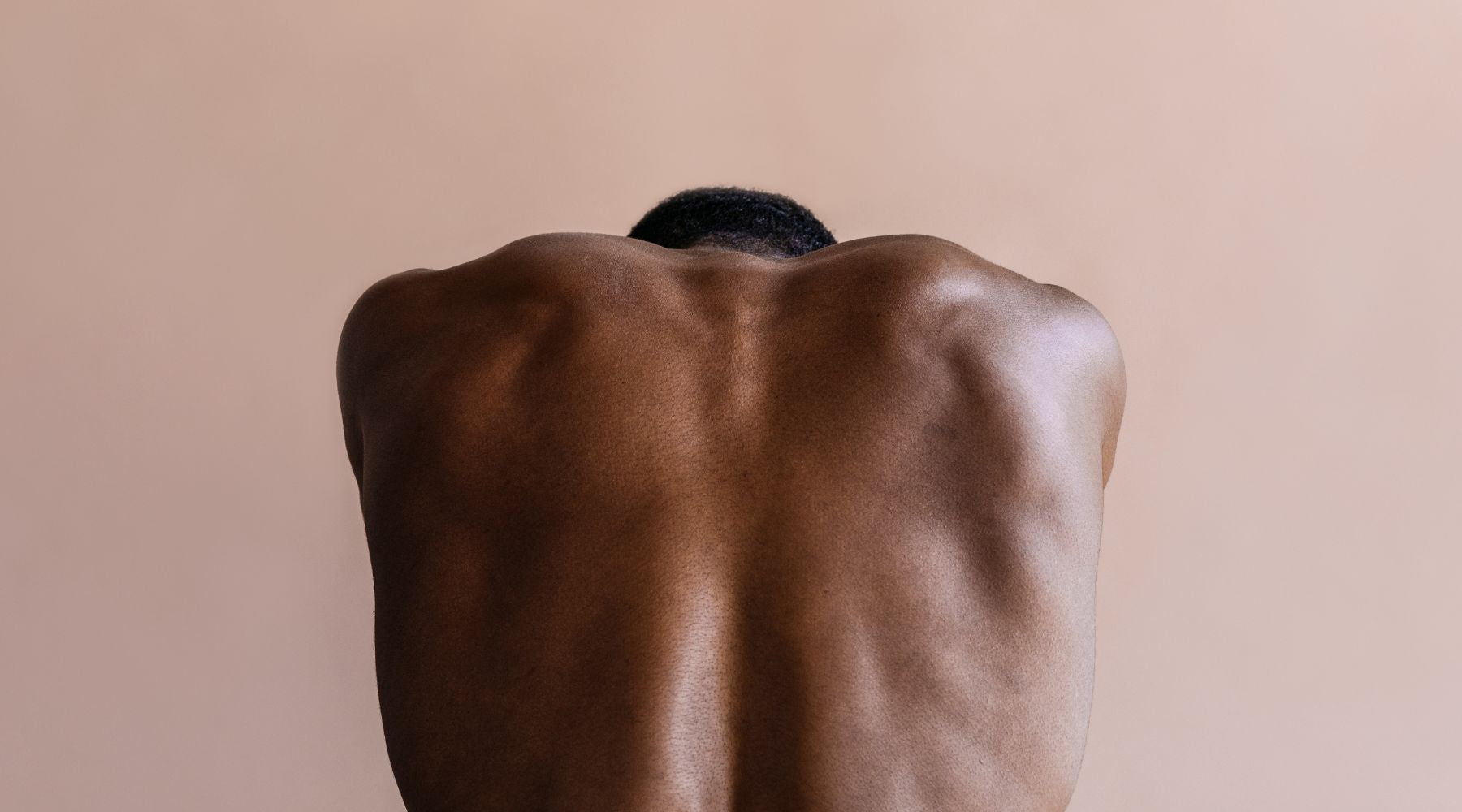 Male Model With Muscular Back Posing For Movember Men's Health Awareness Month | OneNightOnly