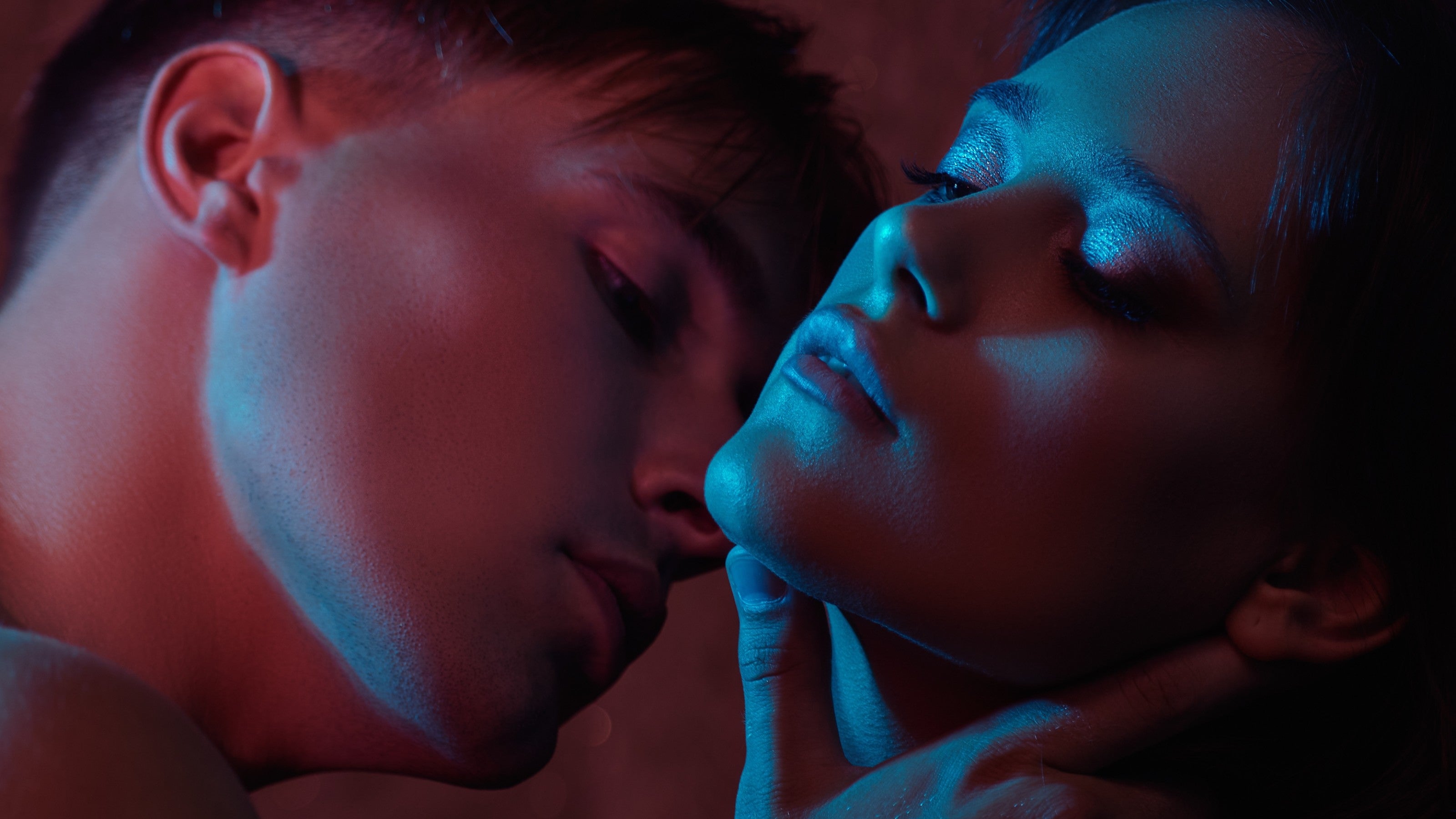 Male Model Sensually Caressing Female Model's Neck For Black Friday | OneNightOnly