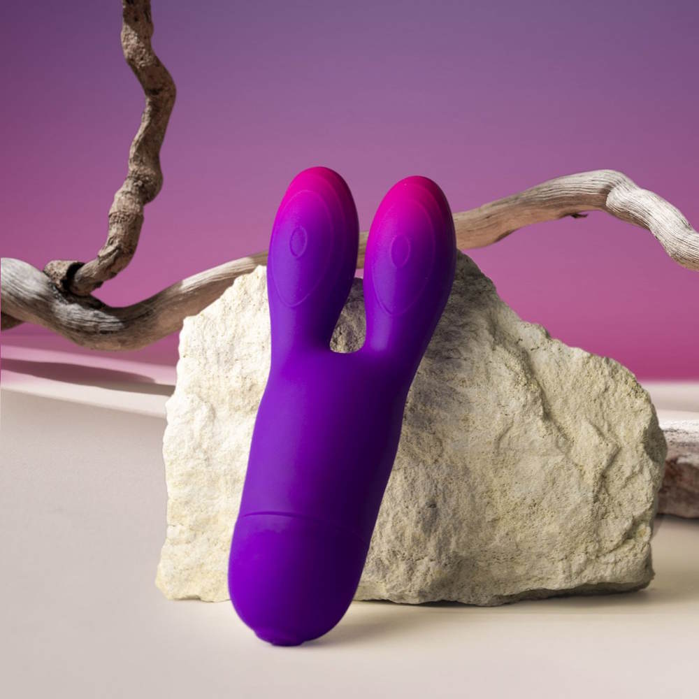 Rocks-Off | Glo Girl Bunny Flexible Rabbit Vibrator Displayed Against a Rock