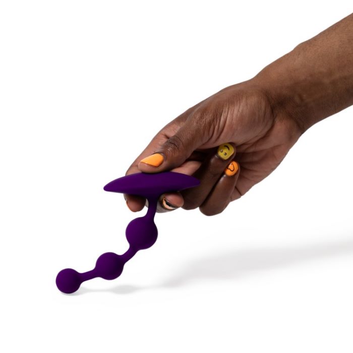 Romp Amp Anal Beads flexing in models hand