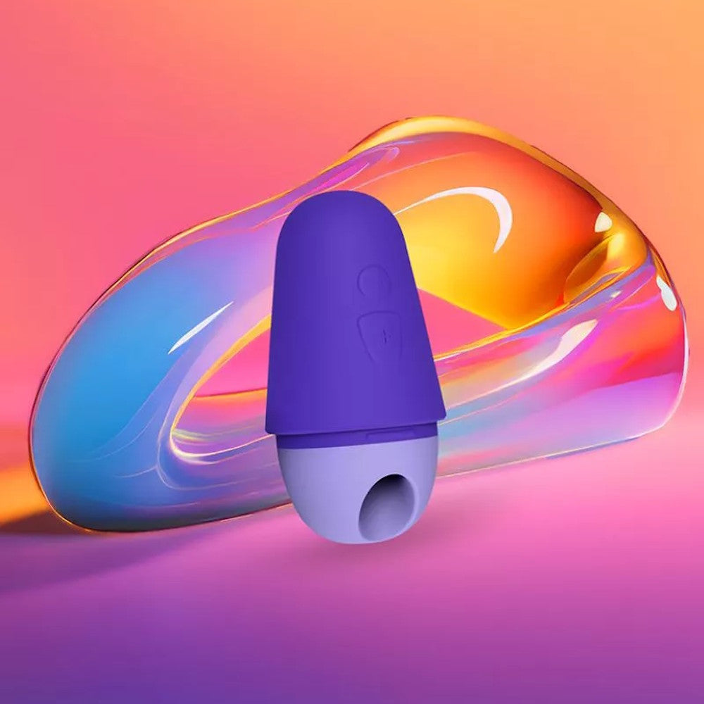 Romp | Free X Clitoral Suction Stimulator Displayed on Multi-Colour Background