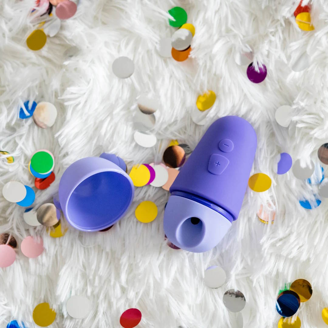 Romp | Free X Clitoral Suction Stimulator on Display With Glitter
