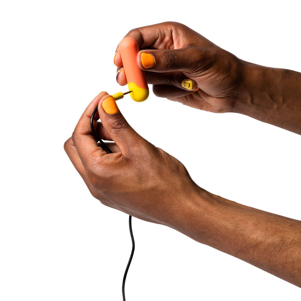Charger being inserted into the Romp | Riot Bullet Vibrator