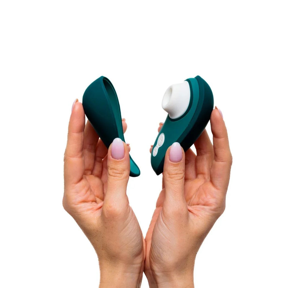 Womanizer | Liberty 2 Pleasure Air Clitoral Suction Vibrator (Dark Petrol) in Model's Hand