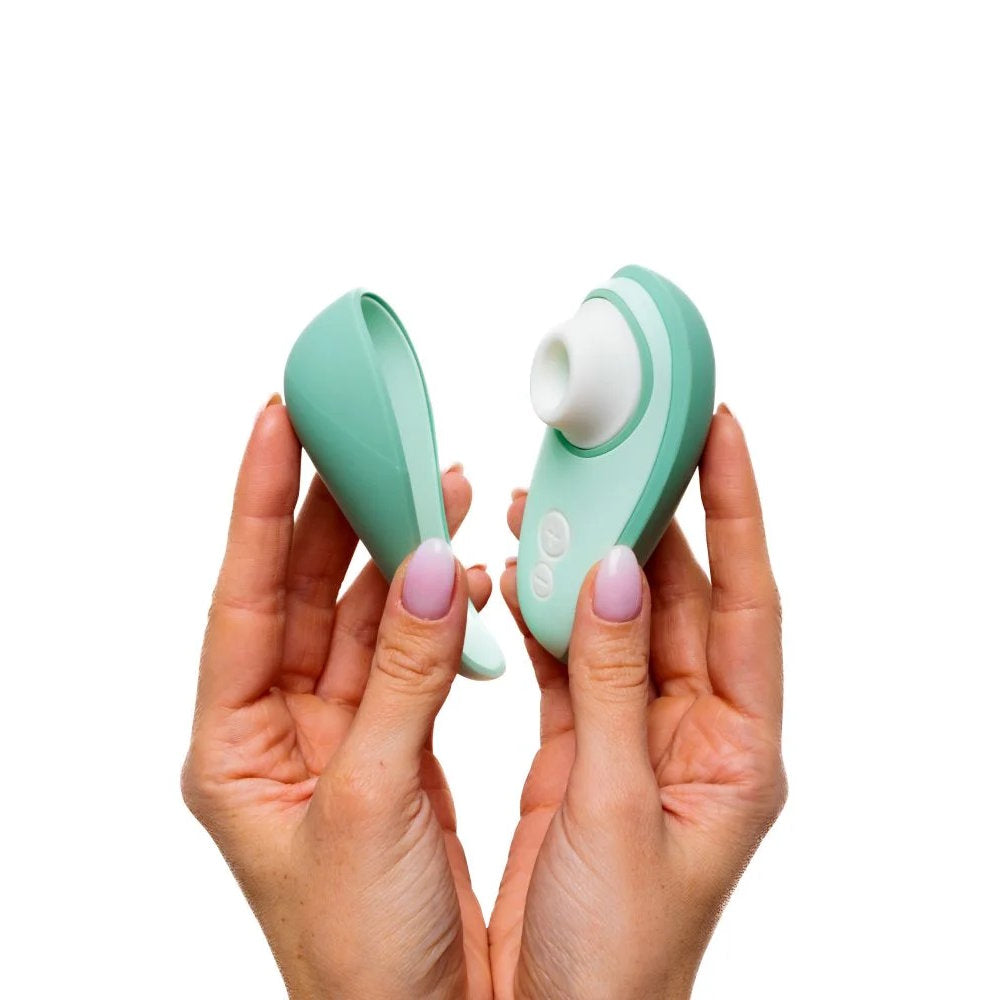 Womanizer | Liberty 2 Pleasure Air Clitoral Suction Vibrator (Sage) in Model's Hand