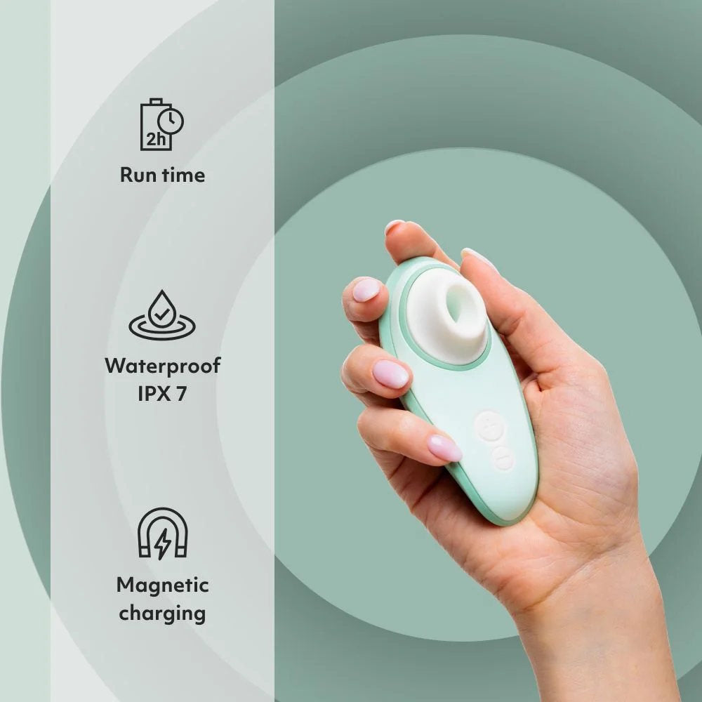 Womanizer | Liberty 2 Pleasure Air Clitoral Suction Vibrator (Sage) in Model's Hand with Features Infographic