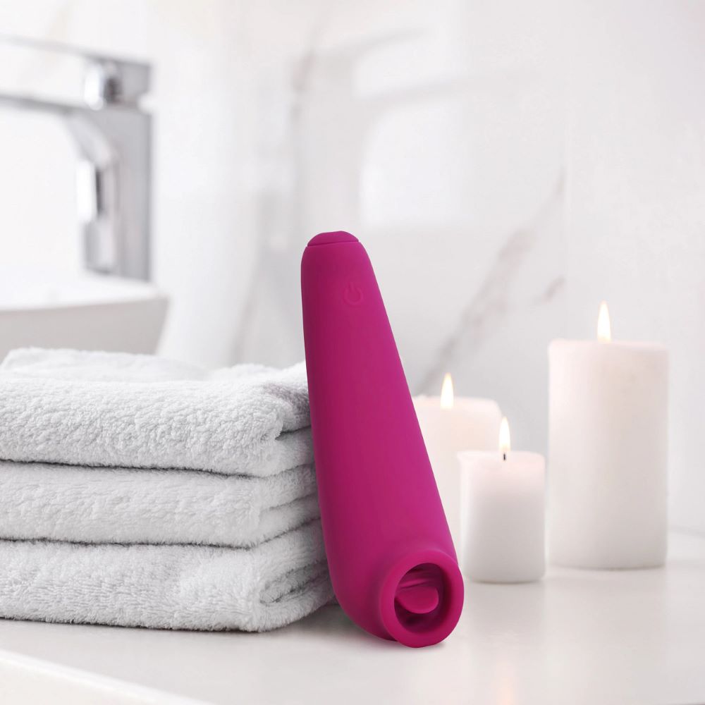 plusOne | Fluttering Clitoral Arouser (Pink) leaning on bathroom towels