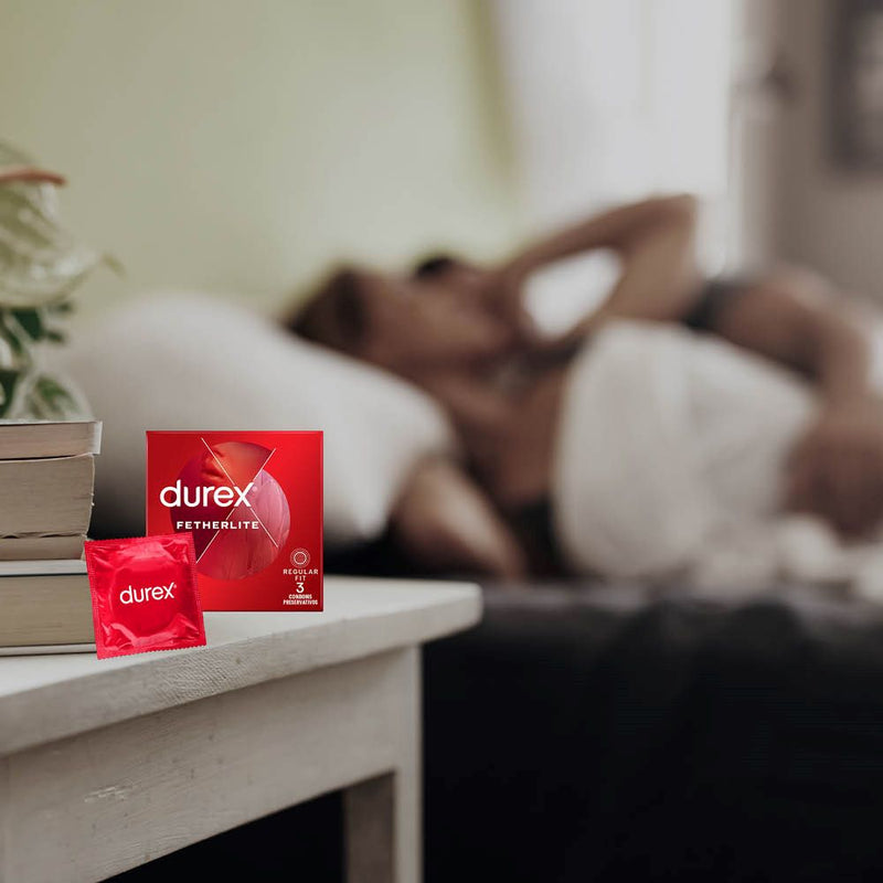 Fetherlite Condoms | Durex (3s) on bedsite table