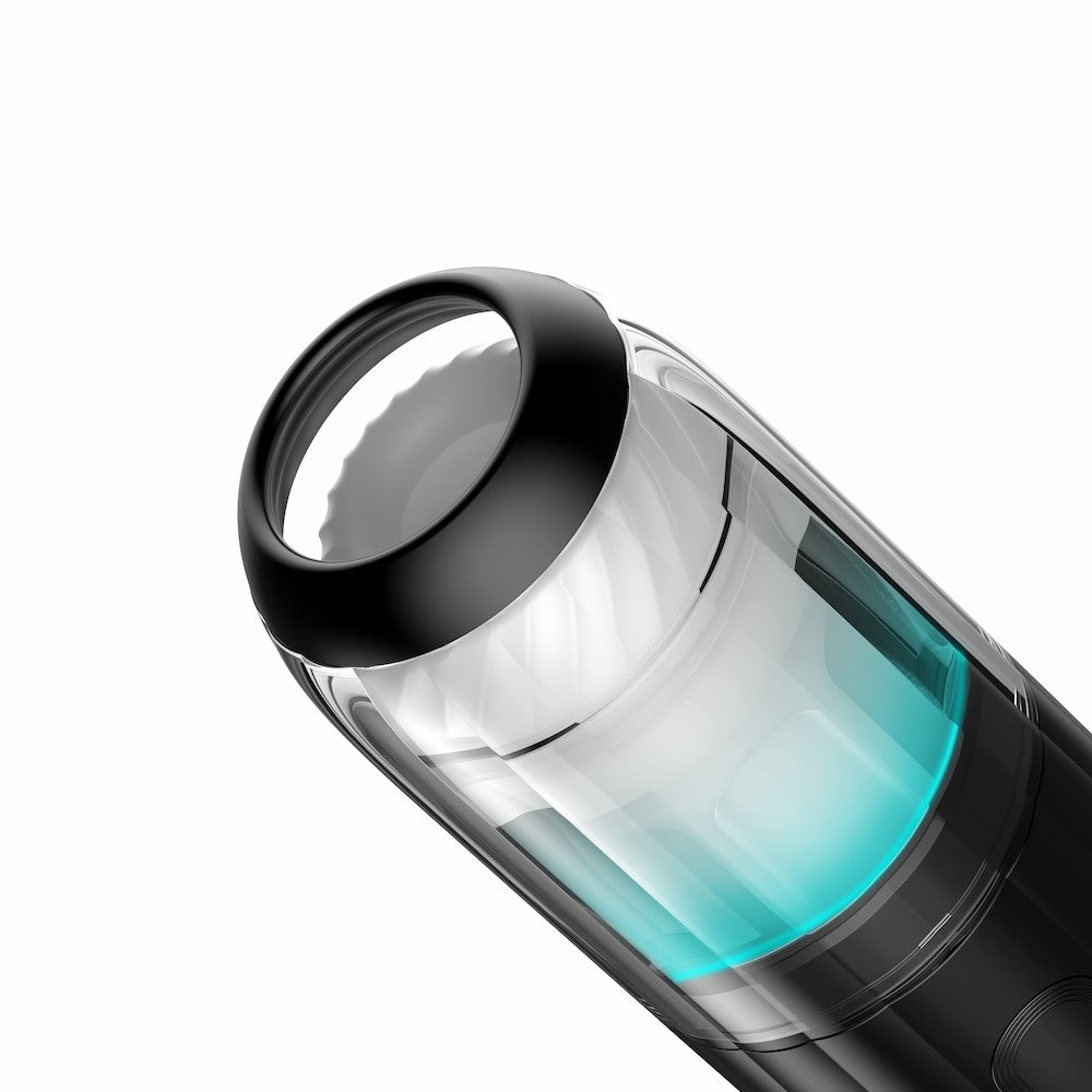Angled close-up view of Kaotik Labs The Shockwave Interactive Powerful Thrusting Masturbator showing the open sleeve area, transparent chamber and black outer body.
