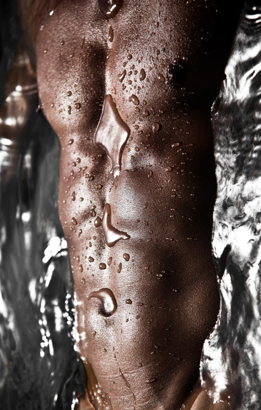 Topless Male Model With Abs Lying In Water | OneNightOnly 