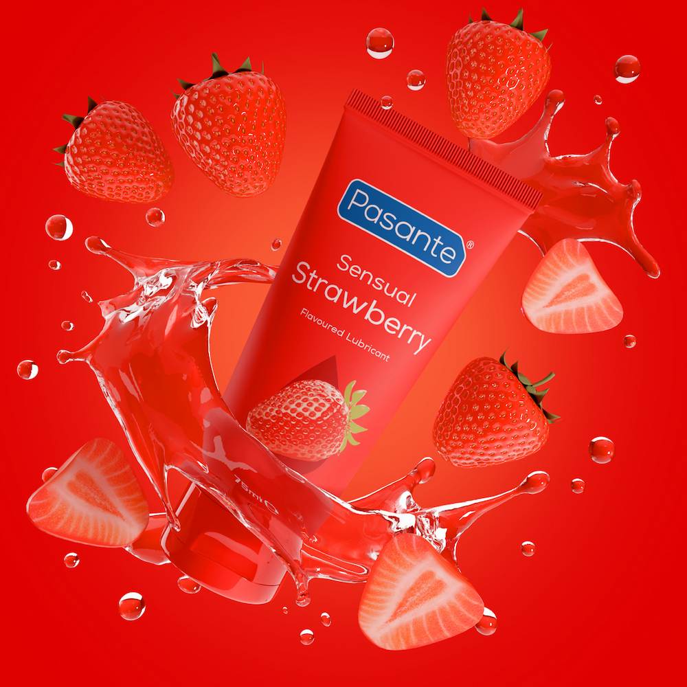 Pasante Strawberry Flavoured Water-Based Lube Floating On A Red Background Surrounded By Strawberries And Lube