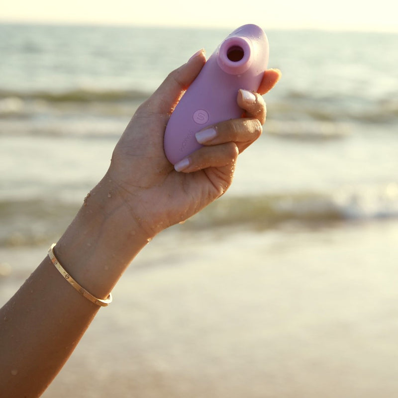 Pulse Lite Neo Interactive Suction Stimulator | Svakom (Lavender) in woman's hand