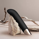 Rocks-Off Chaiamo G G-Spot Vibrator (Black) leaning on a rock