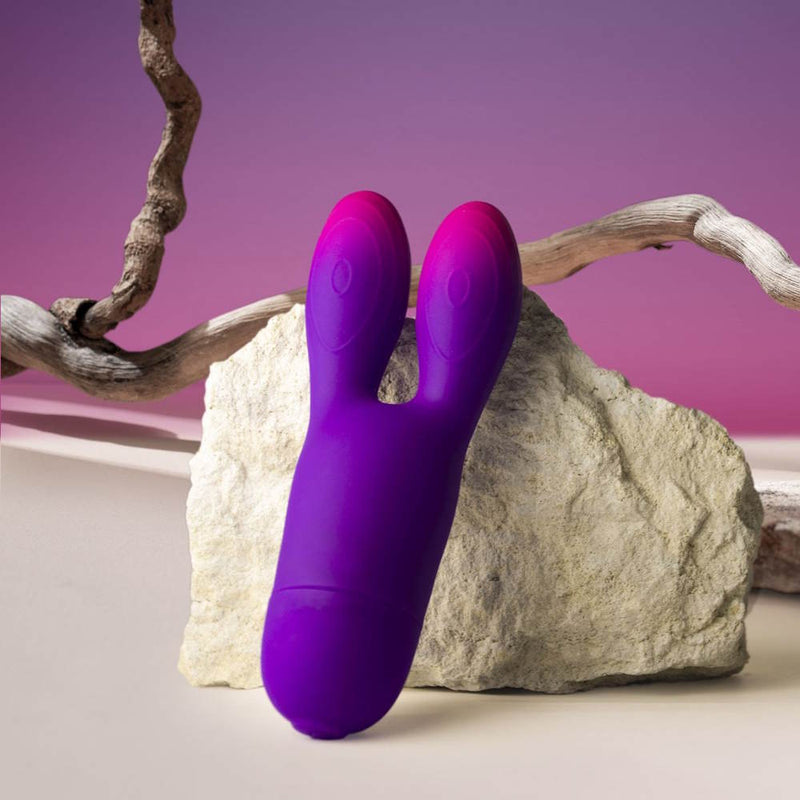 Rocks-Off | Glo Girl Bunny Flexible Rabbit Vibrator Displayed Against a Rock