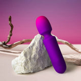 Rocks-Off | Glo Girl Mini Wand Vibrator Leaning Against a Rock
