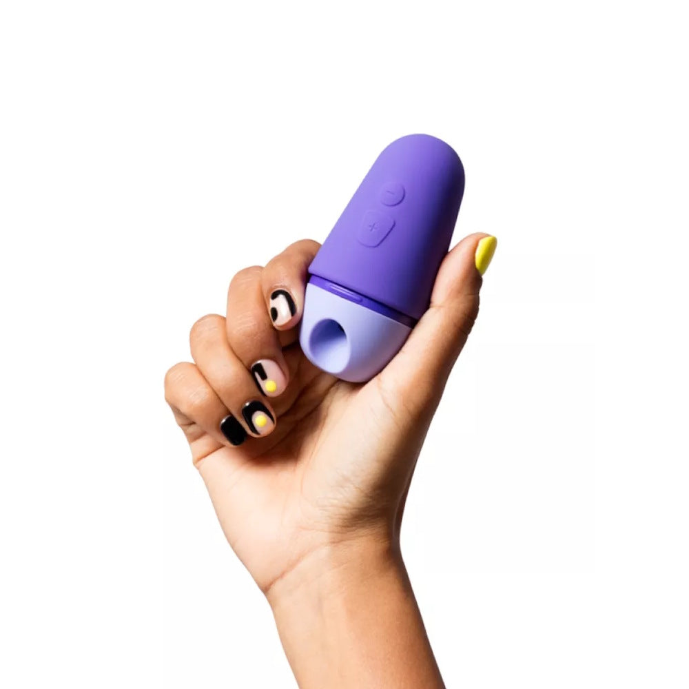Romp | Free X Clitoral Suction Stimulator in Hand