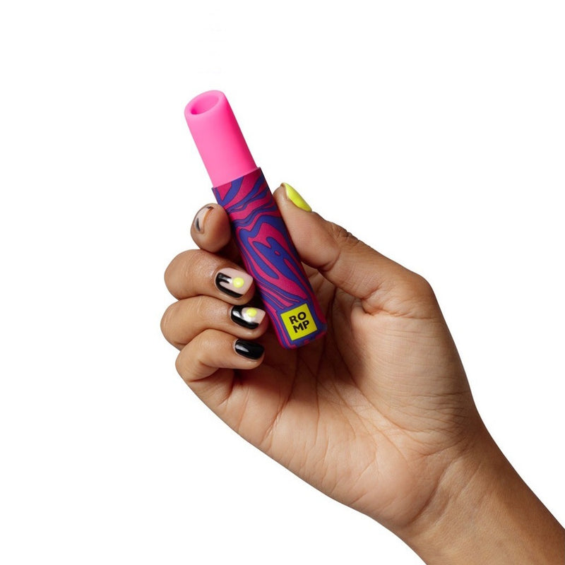 Romp Lipstick Clitoral Suction Stimulator in hand