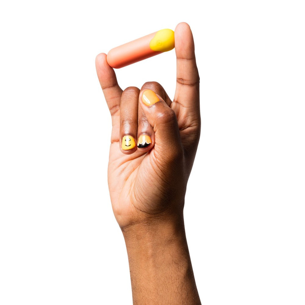 Romp | Riot Bullet Vibrator between models fingers