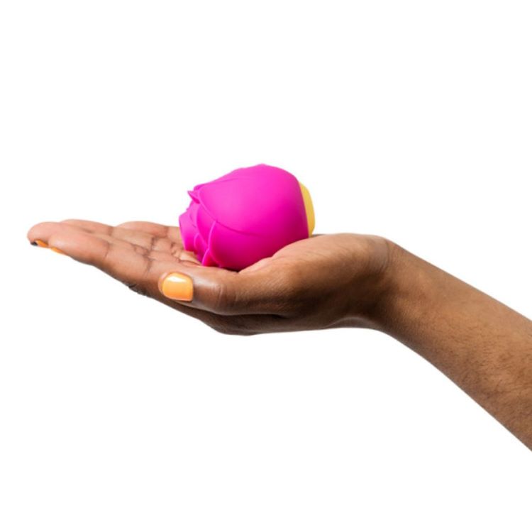 Romp | Rose Clitoral Stimulator in hand