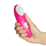 Romp | Shine Clitoral Suction Vibrator in hand