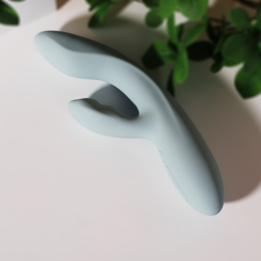 Svakom | Chika App-Controlled Heating Rabbit Vibrator on a Table with Plant