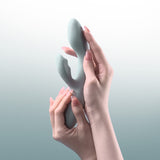 Svakom | Chika App-Controlled Heating Rabbit Vibrator Held in Both Hands by a Model