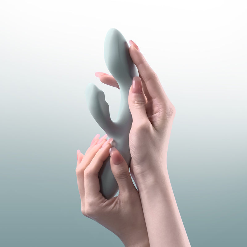 Svakom | Chika App-Controlled Heating Rabbit Vibrator Held in Both Hands by a Model