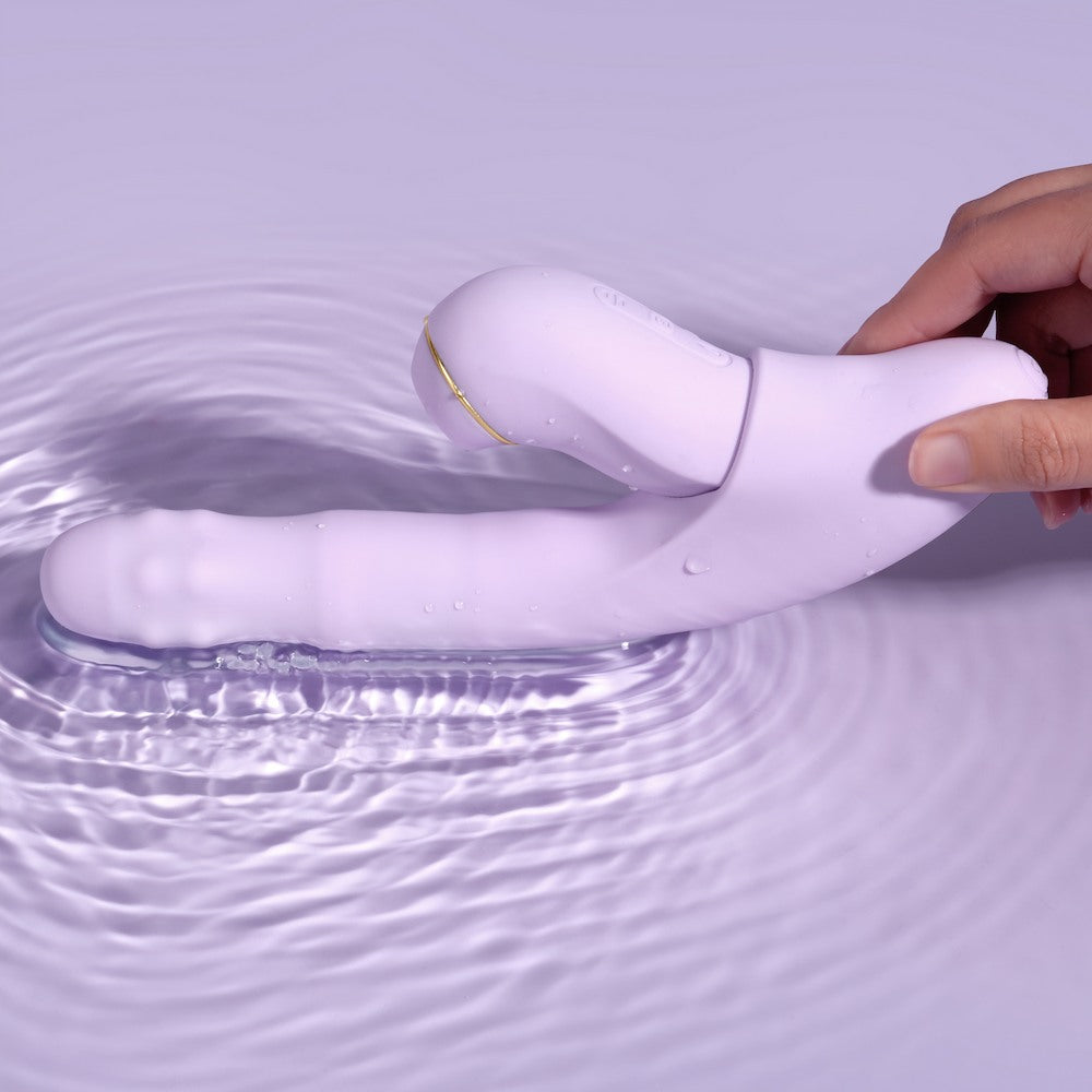 Hand Holding Svakom DuoGlow Thrusting Beaded G-spot Vibrator With Pulsating Clitoral Stimulator Vibrating In Water While Vibrating