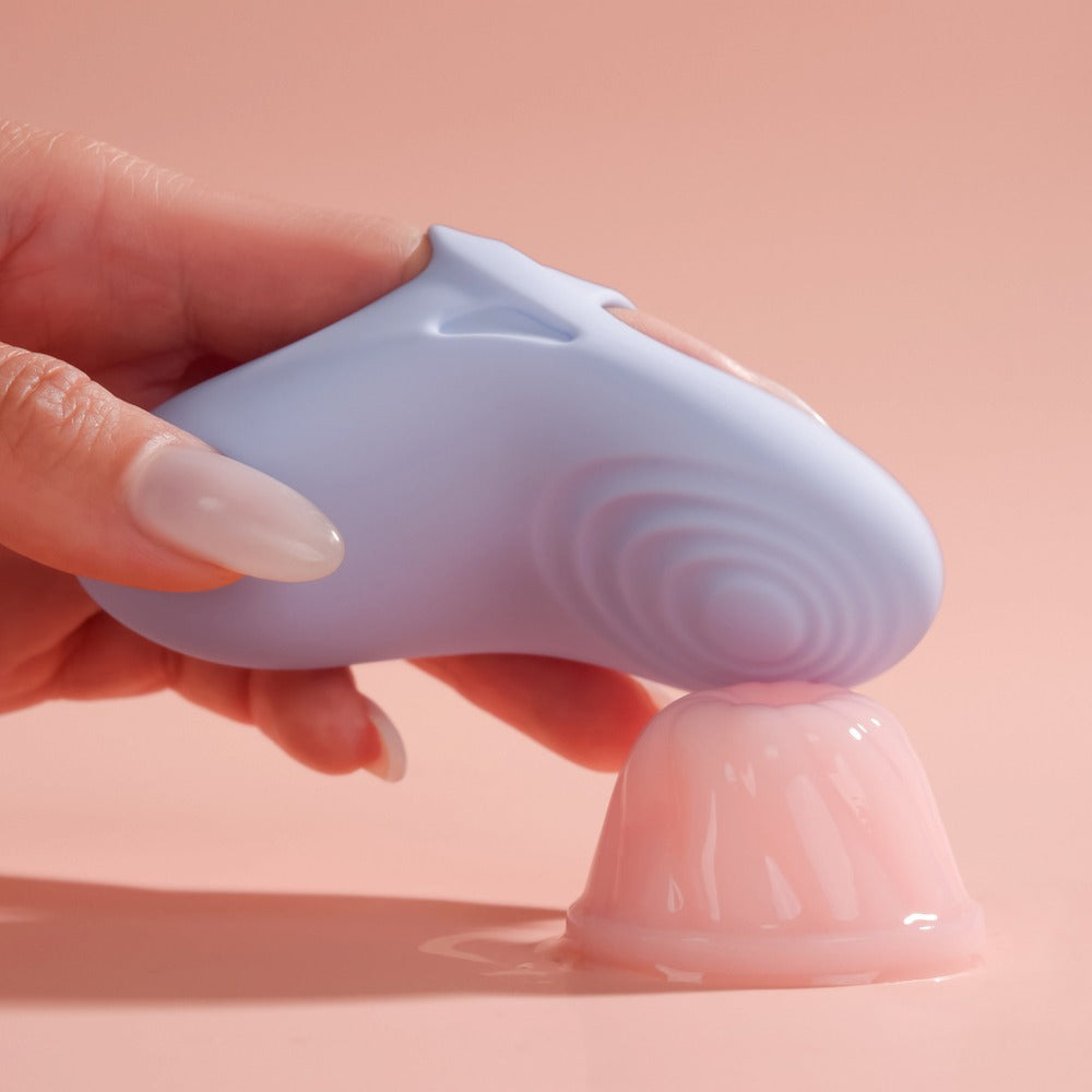 Hand Holding Svakom Echo 2 App-Controlled Flexible Finger Vibrator (Sky Blue) On Jelly