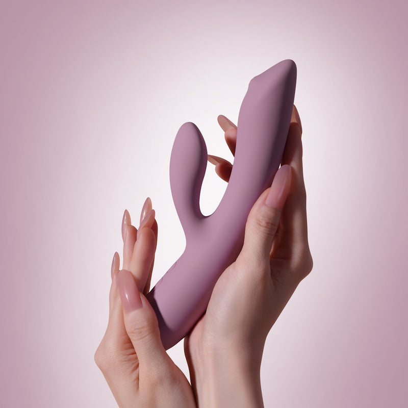 Svakom | Trysta Neo Interactive Rabbit Vibrator with G-Spot Ball Held in Both Hands by Model