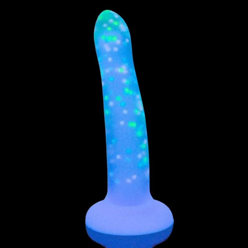 Swan Addiction | Rave 8 Inch Glow-In-The-Dark Purple Confetti Suction Cup Dildo glowing in the dark