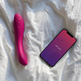 We-Vibe | Rave 2 G-Spot Vibrator on a bed with a smartphone