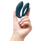 We-Vibe | Sync O Couples Vibrator (Green Velvet) in hand