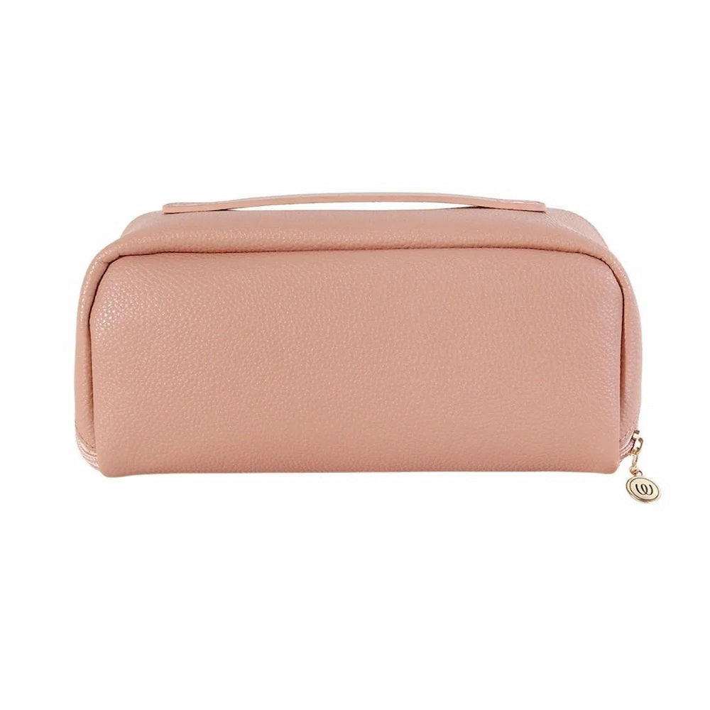 The dusty pink vegan leather Womanizer Cosmetic Toy Bag with a gold-tone zipper pull, shown against a plain white background