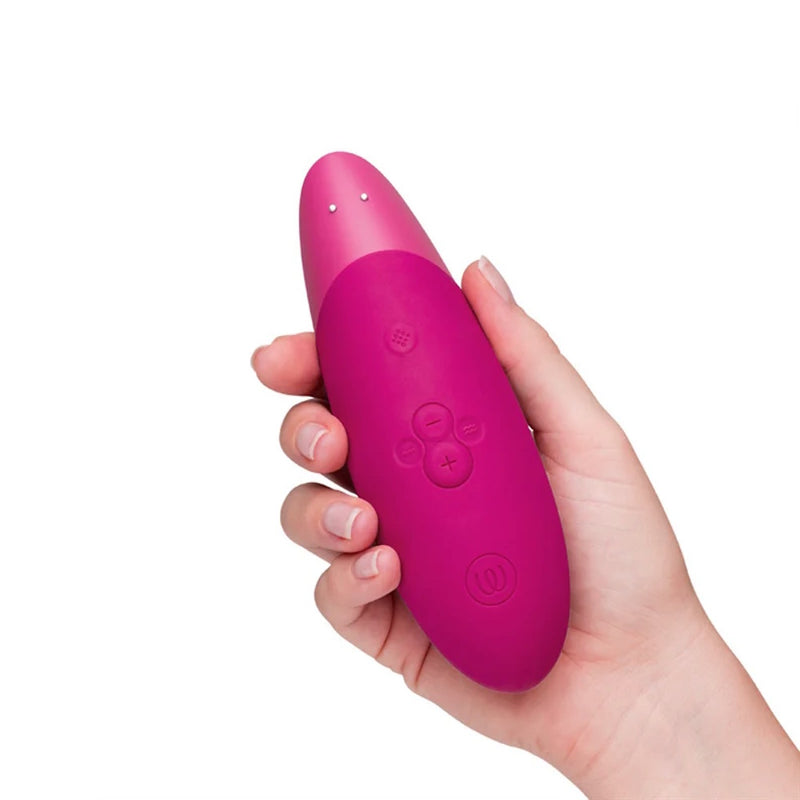 Womanizer | Enhance Clitoral Stimulator with Pleasure Air & Vibrations in Hand Top View