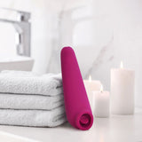 plusOne | Fluttering Clitoral Arouser (Pink) leaning on bathroom towels 