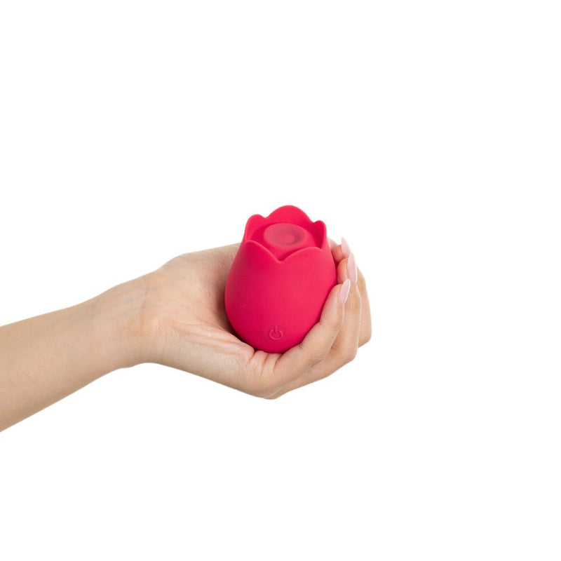 plusOne | Rose Pulsing Clitoral Arouser (Red) cupped in woman's hand