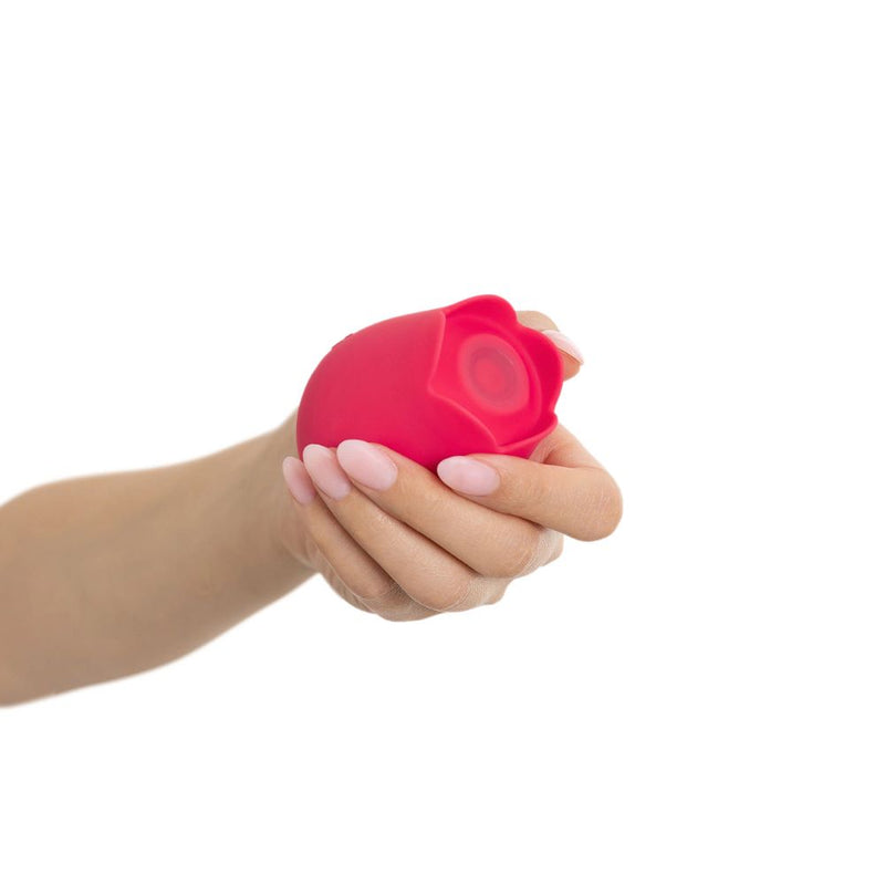 plusOne | Rose Pulsing Clitoral Arouser (Red) in woman's hand