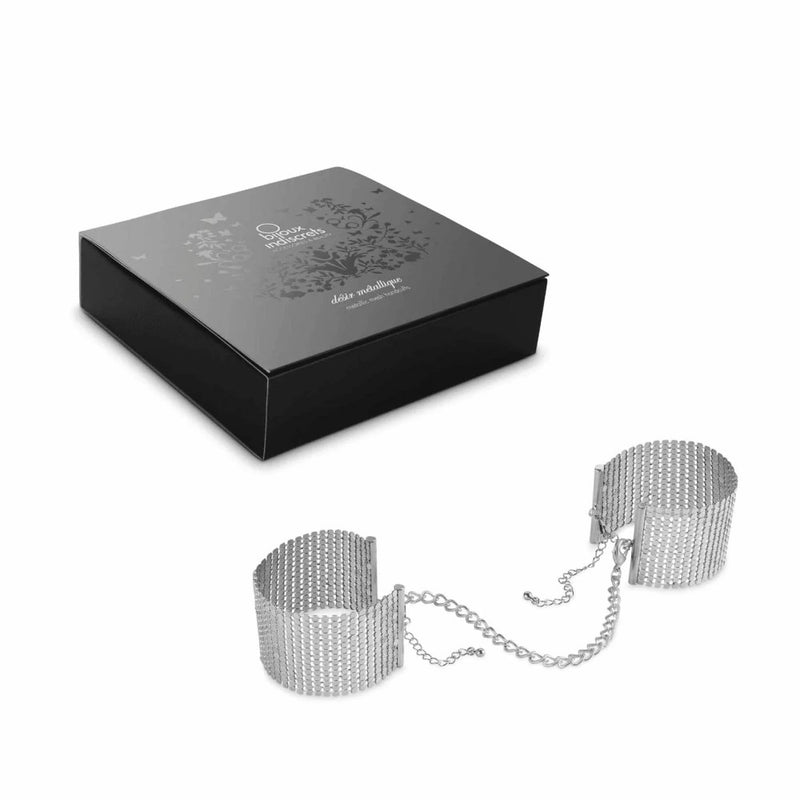 Full view of Désir Métallique Mesh Handcuffs | Bijoux Indiscrets - Silver with product packaging 