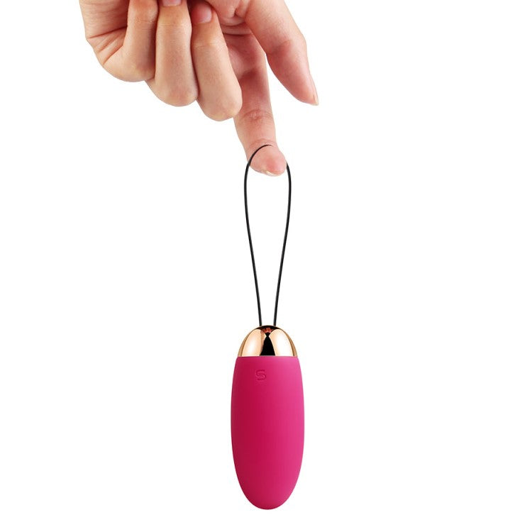 Elva Remote-Controlled Vibrating Bullet Egg | Svakom - Plum Red  in hand 