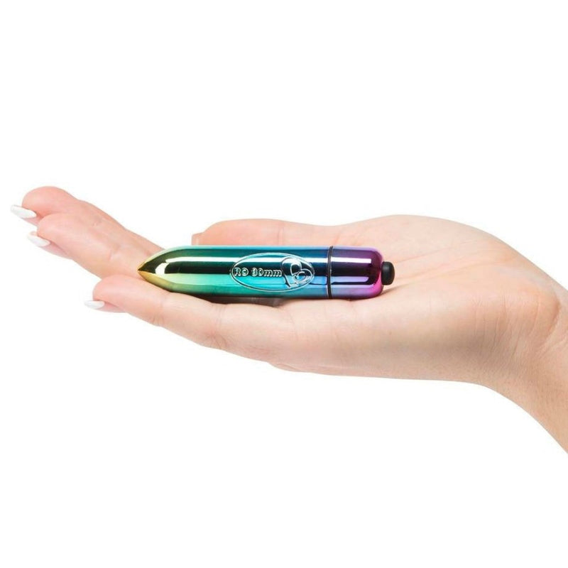 Flat lay view of RO-80mm 7 Speed Rainbow Bullet Vibrator | Rocks-Off in hand 