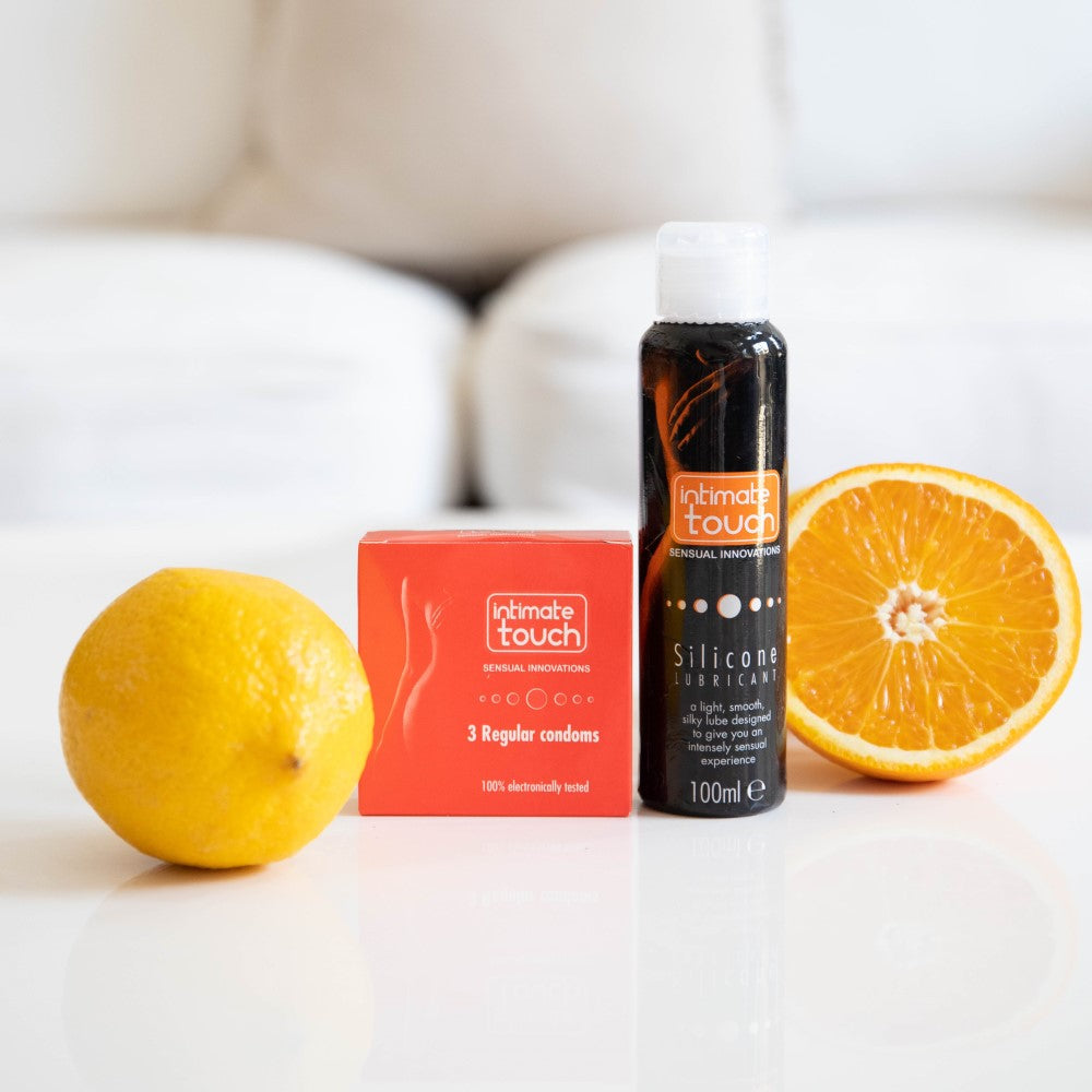 Silicone Lubricant (100ml) with Intimate Touch condoms and oranges