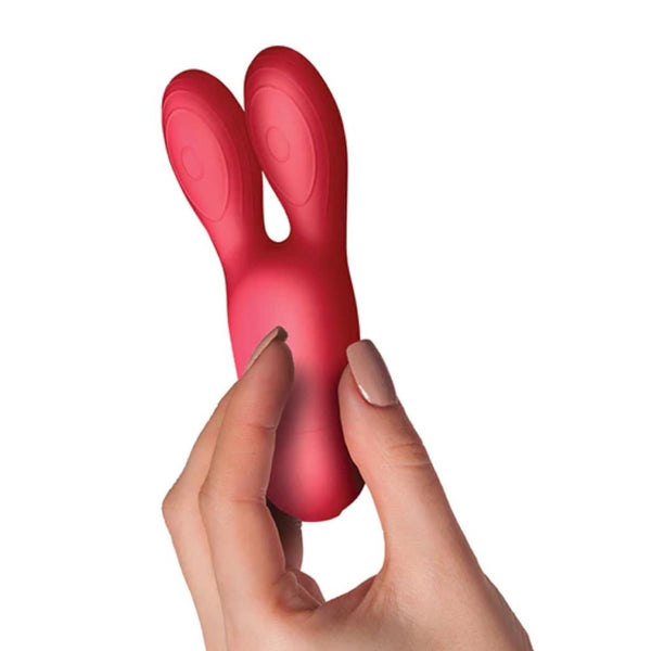 Sugarboo | Coral Kiss Rabbit Ears Vibrator in hand 