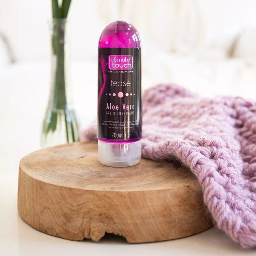Tease 2-In-1 Massage Gel & Lubricant with Aloe Vera (200ml) | Intimate Touch on wooden stand